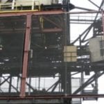 unload-er cladding for dust control